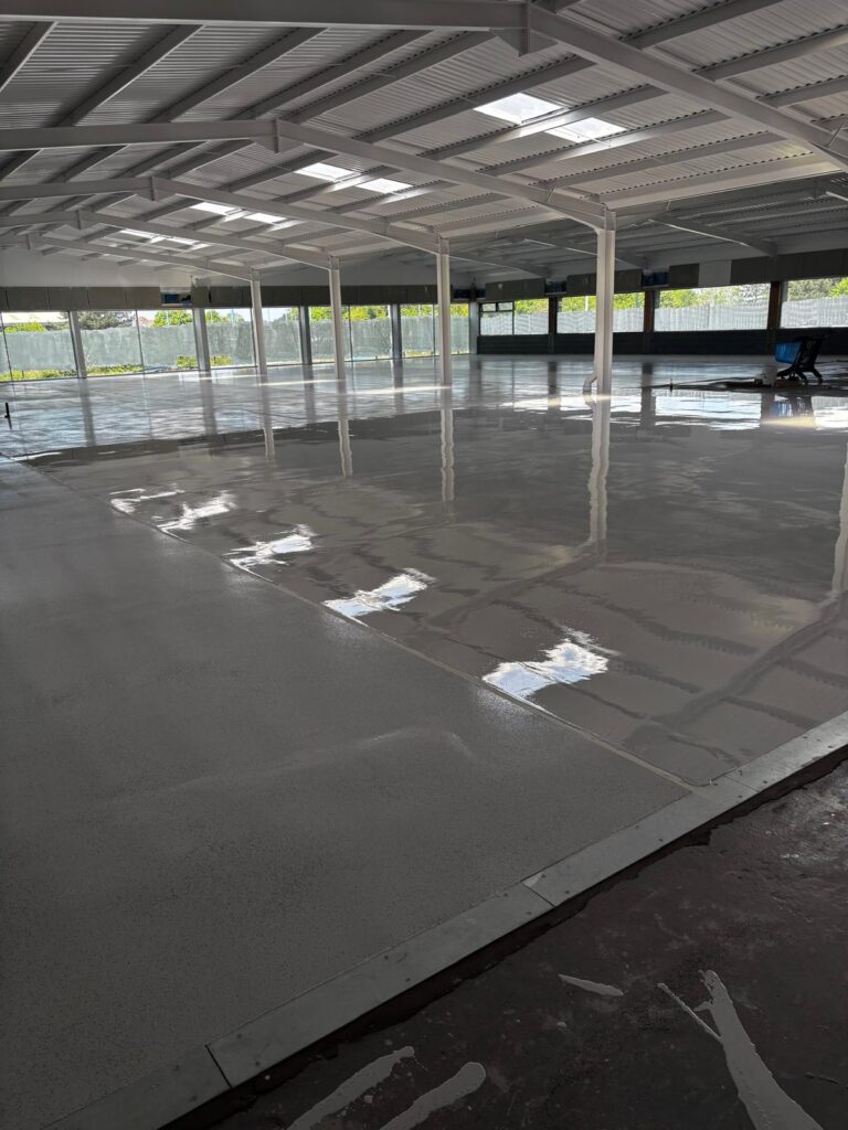 Wide view of self levelling epoxy resin floor with UV-stable top coat applied, ready for decorative flake.