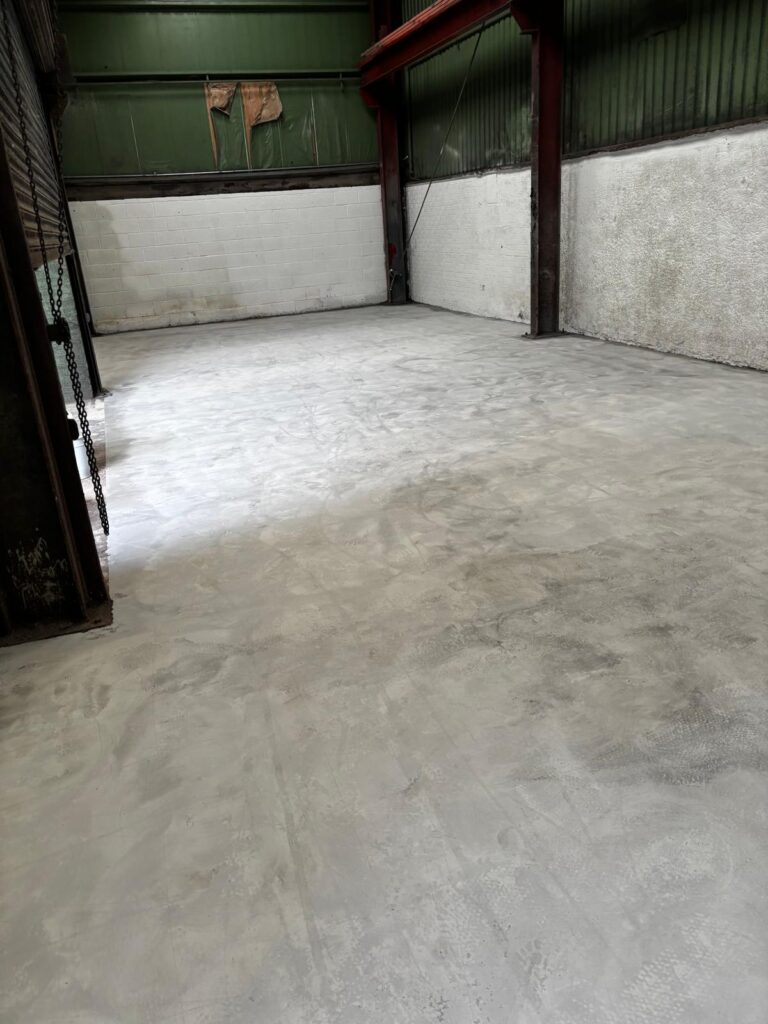 Mechanically prepared epoxy screed surface before high build epoxy resin coating